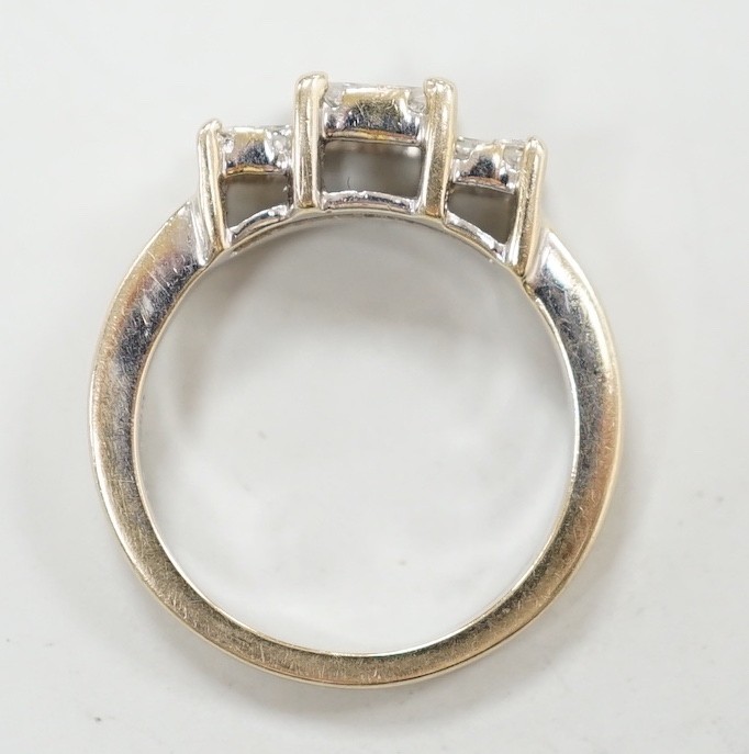 A modern 18ct white gold and triple princess cut diamond cluster set dress ring, size K, gross weight 5 grams.
